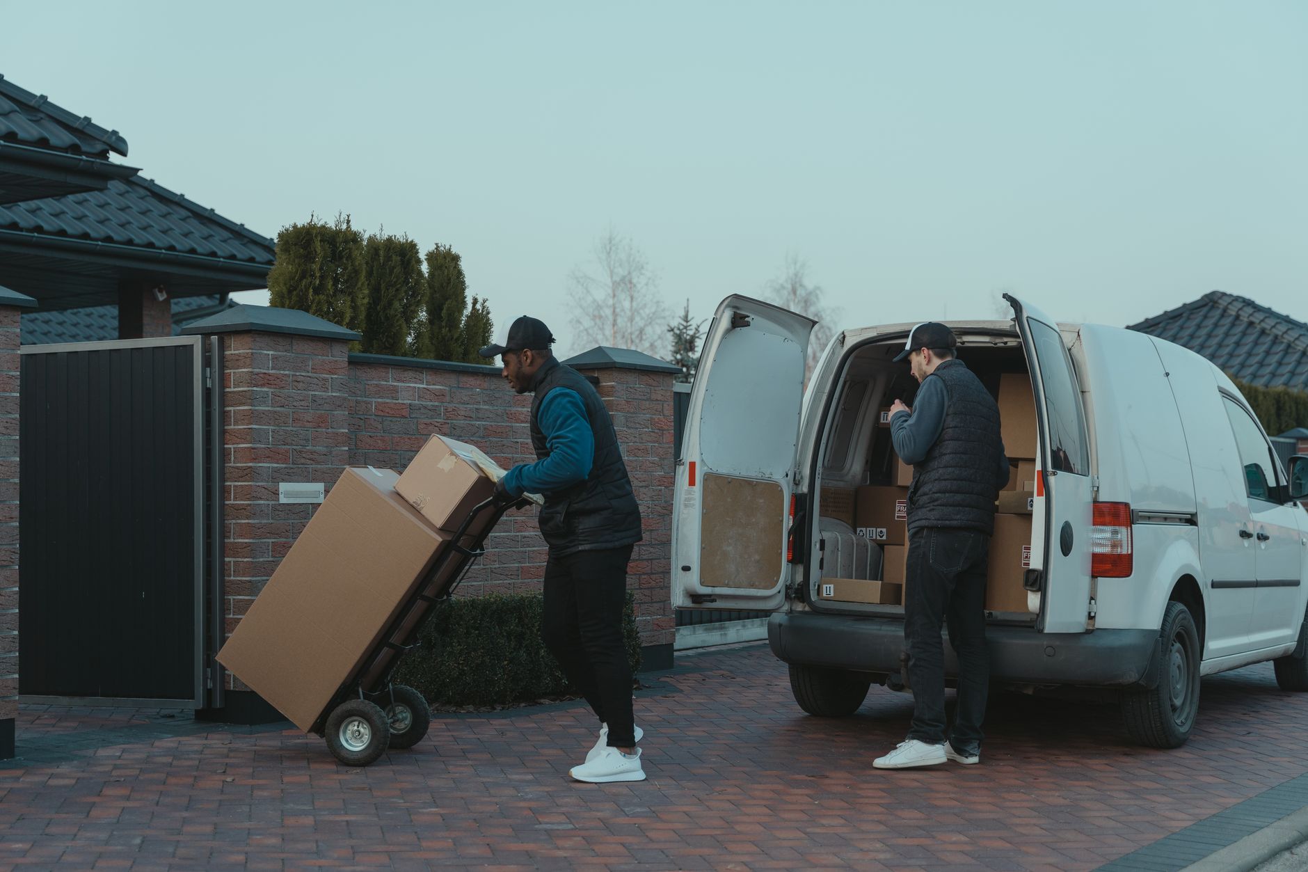 moving van loading dog crate driveway