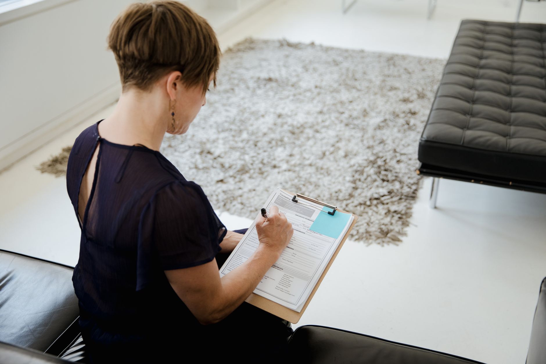 woman filling out veterinary health certificate paperwork for pet travel