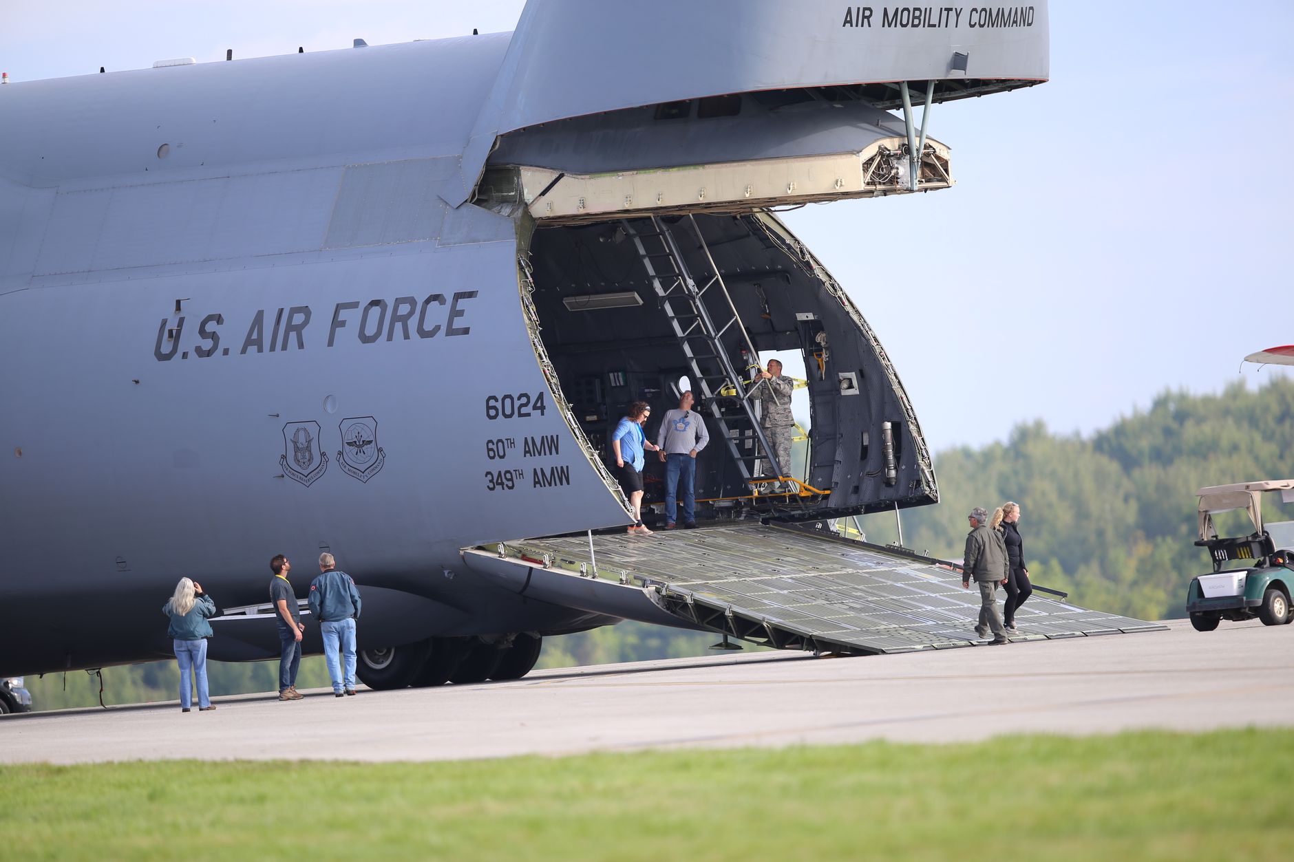 large dog crate being loaded into airplane cargo hold