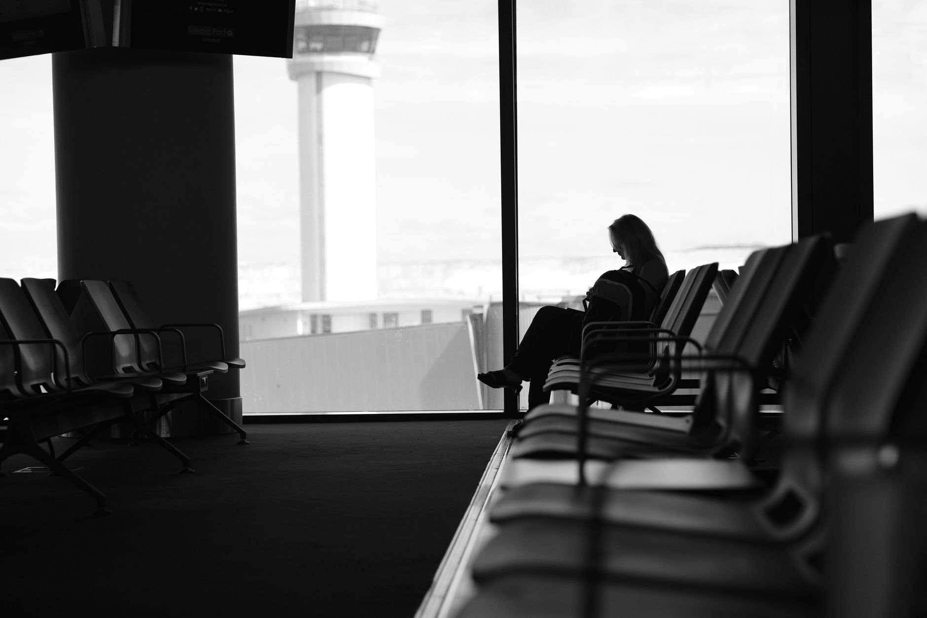 cat carrier bag on airport terminal seating area