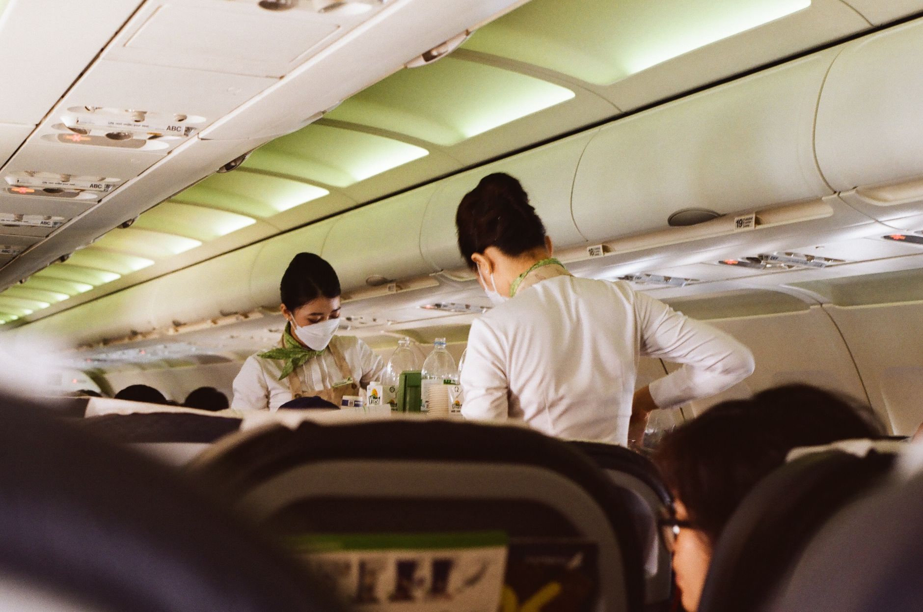 passenger measuring pet carrier with tape before flight