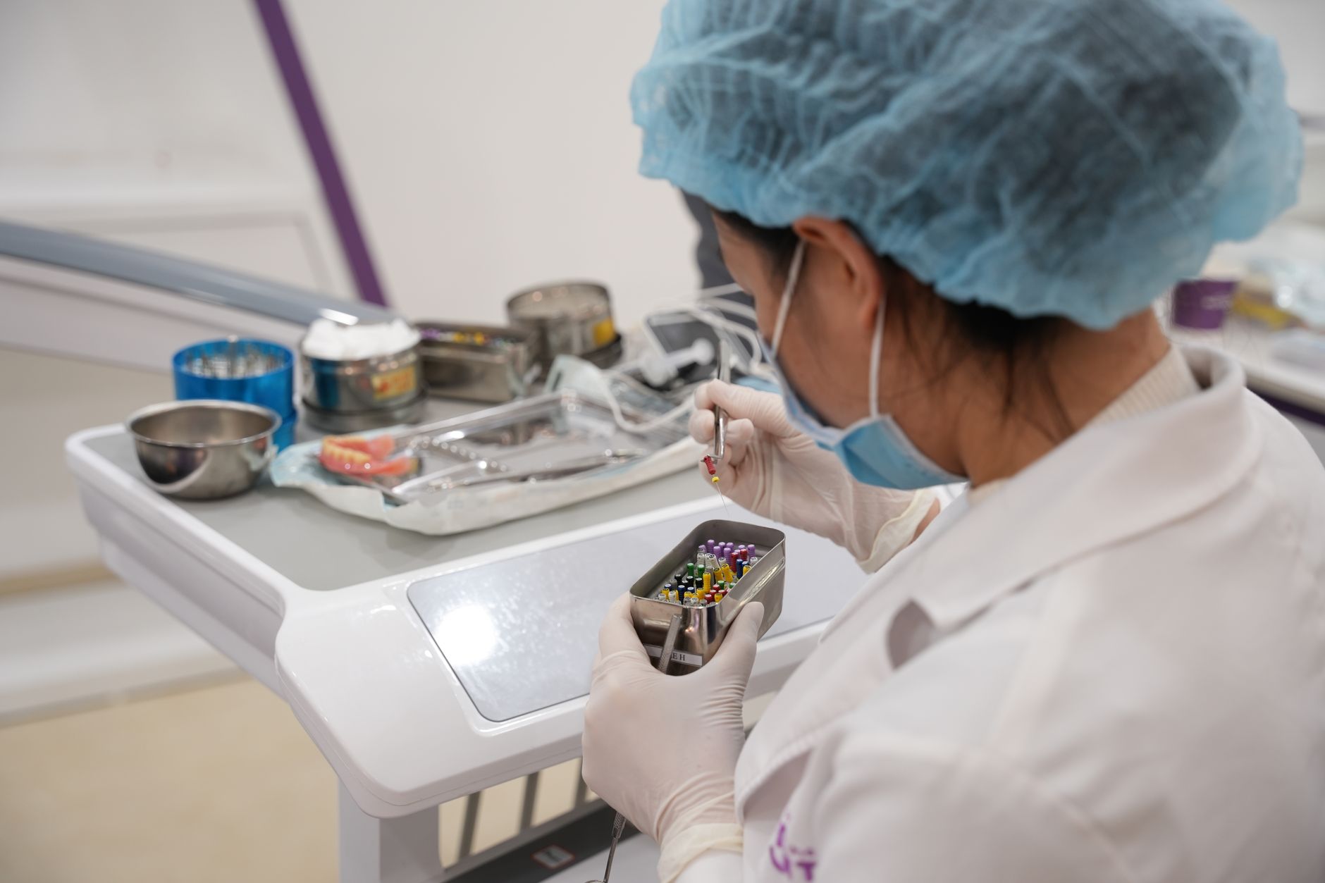 laboratory technician packing a chilled serum tube into an overnight courier box