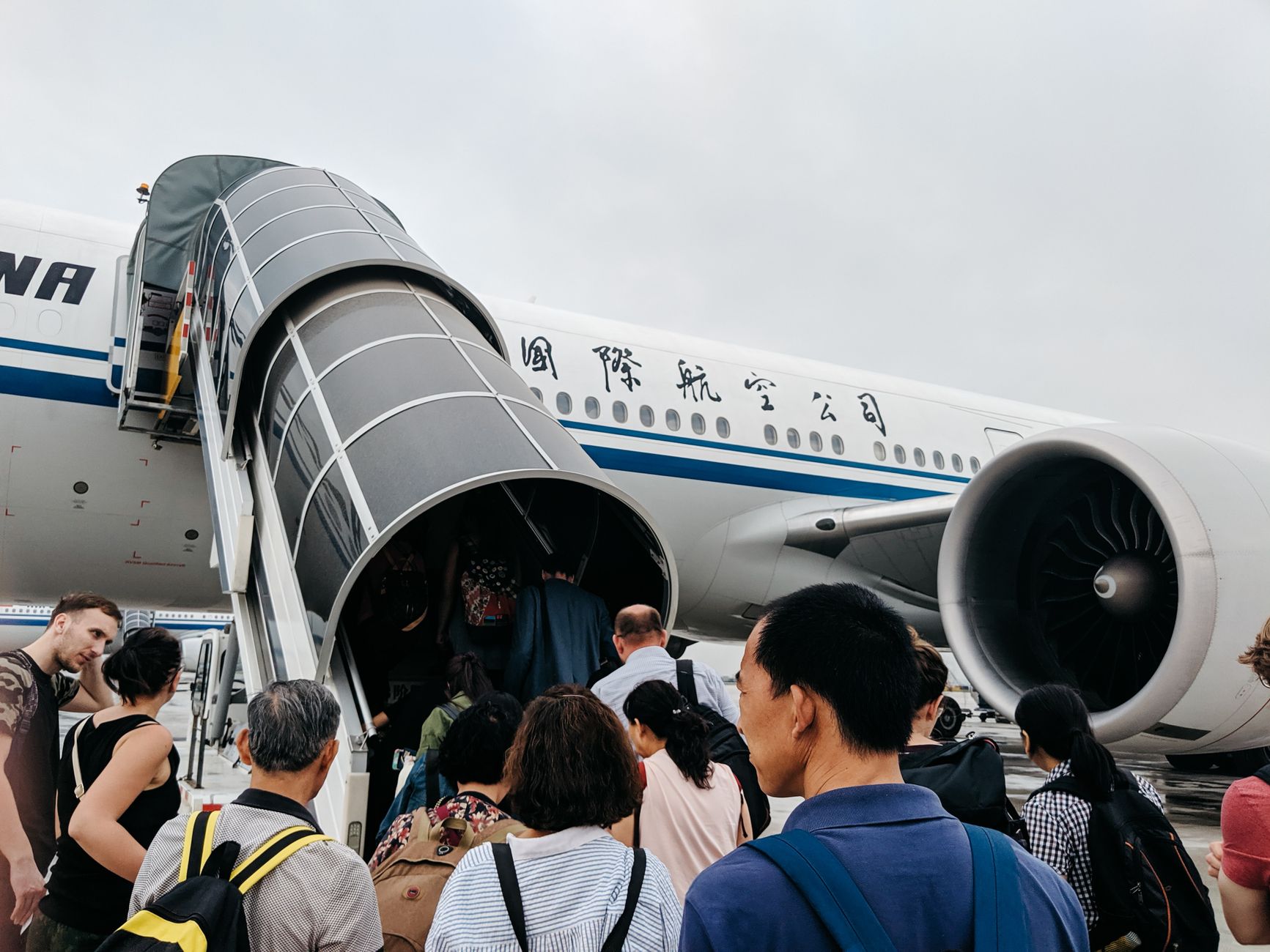 passenger boarding international flight with cat travel crate