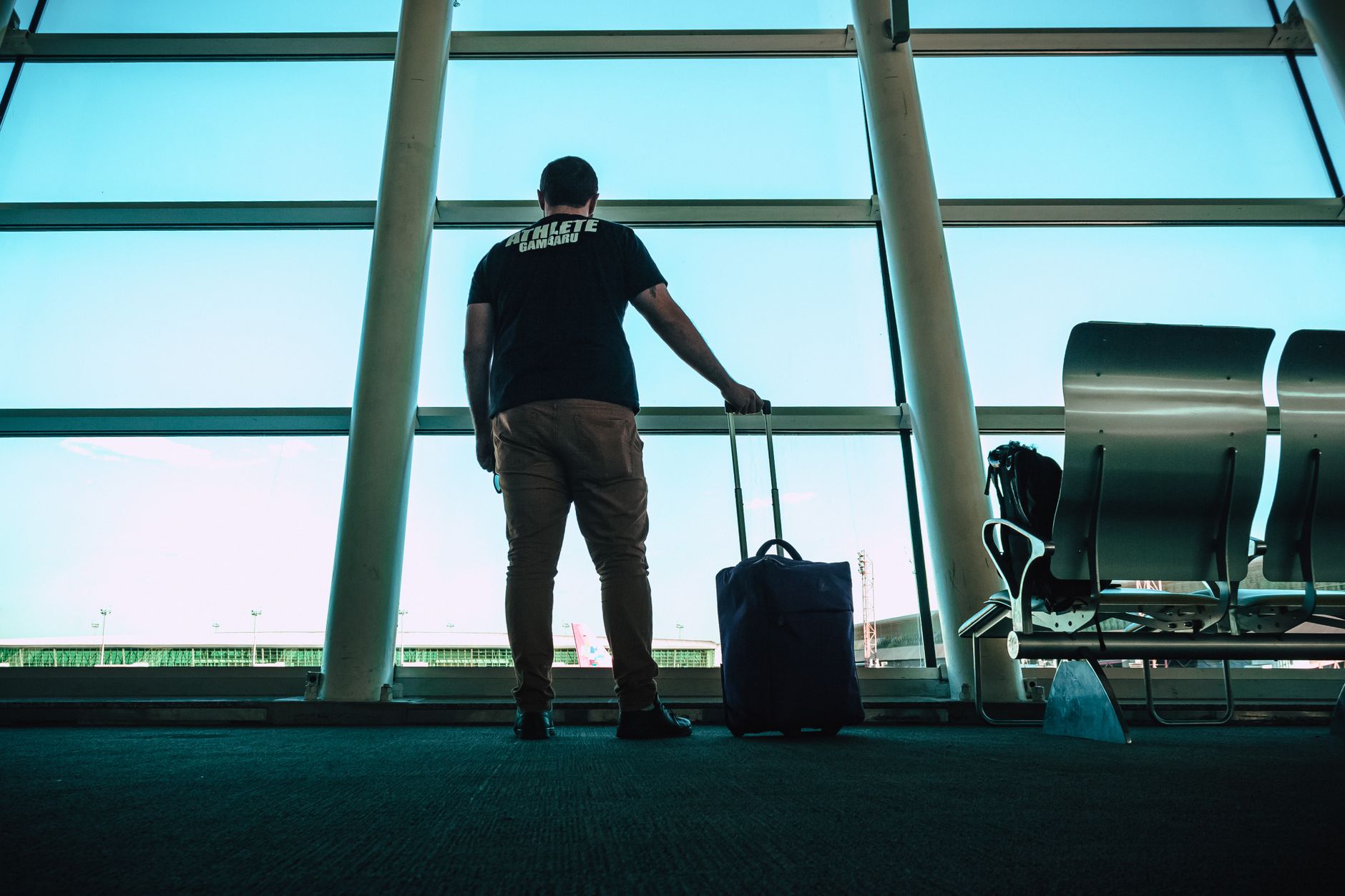 traveler with cat carrier airport gate