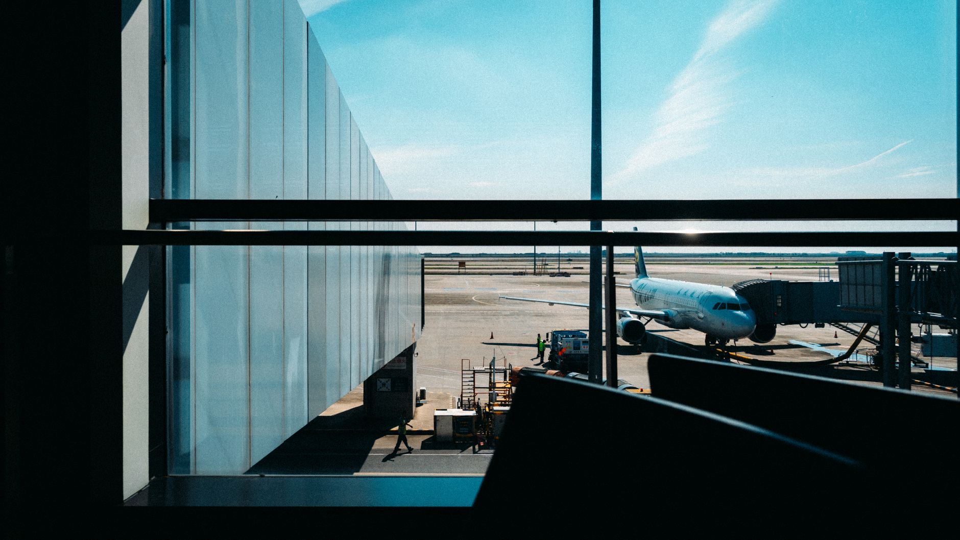 traveler with leashed dog at airport boarding gate paperwork