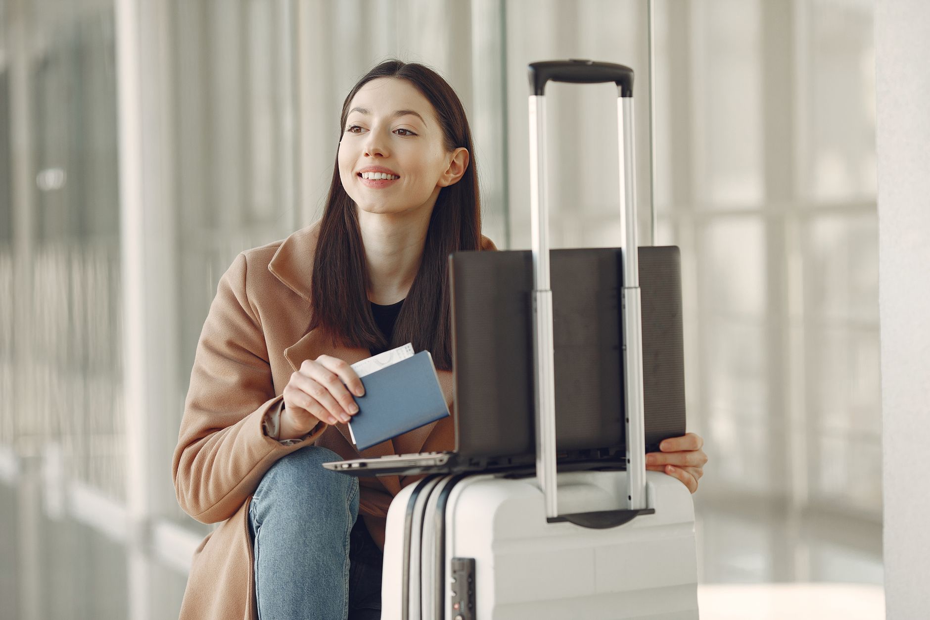 traveler checking in pet carrier at airline ticket counter