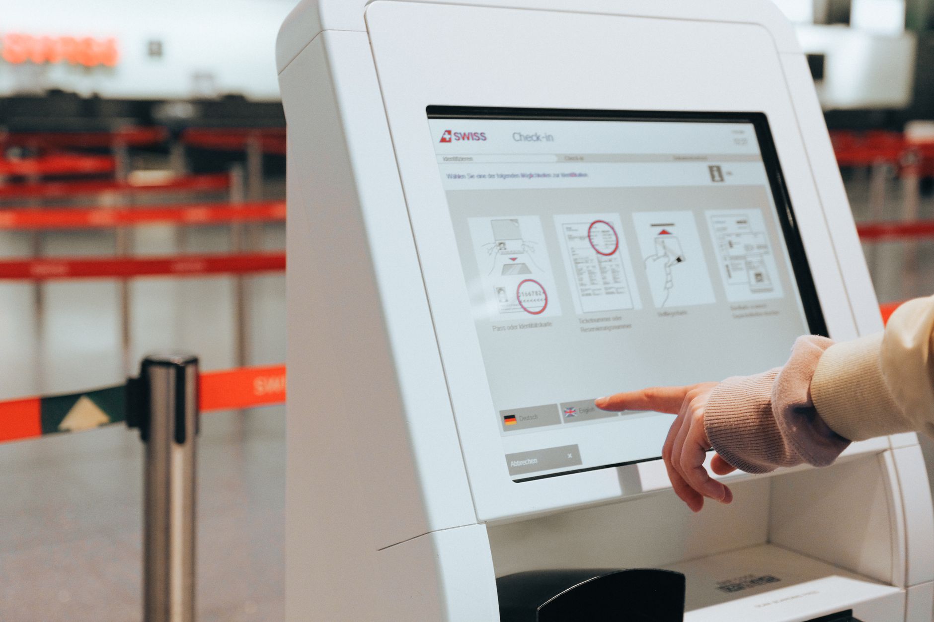 traveler checking in cat carrier at airline ticket counter