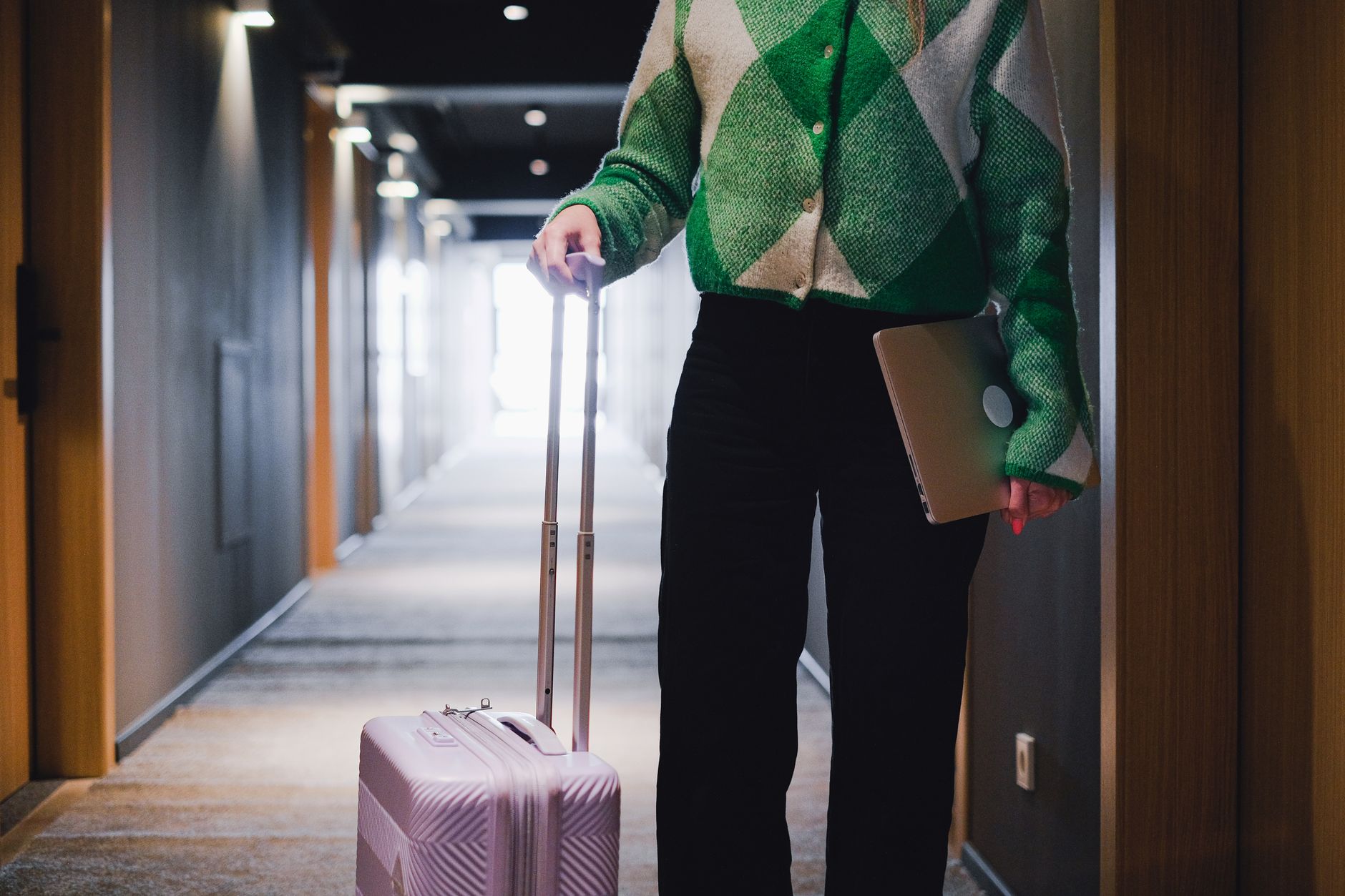 traveler reviewing pet health certificate suitcase hotel lobby
