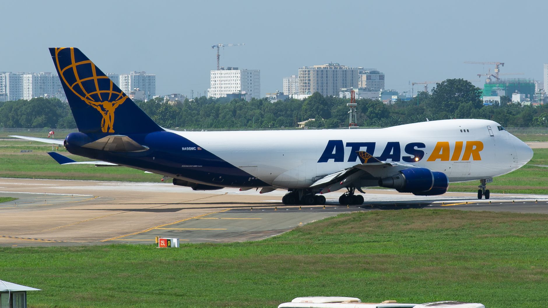 large dog inside plastic airline crate on cargo tarmac