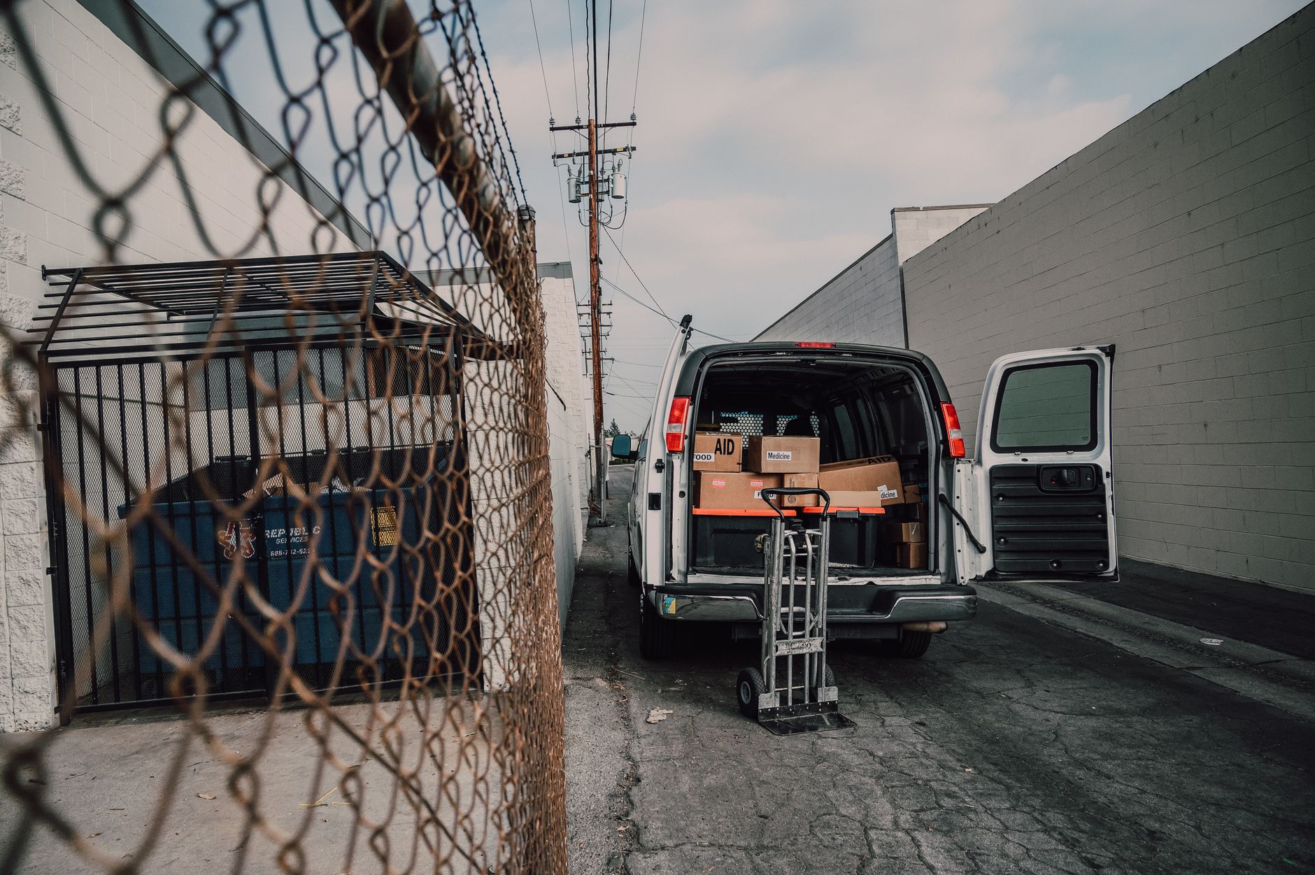 dog travel crate loaded into van for cross country move