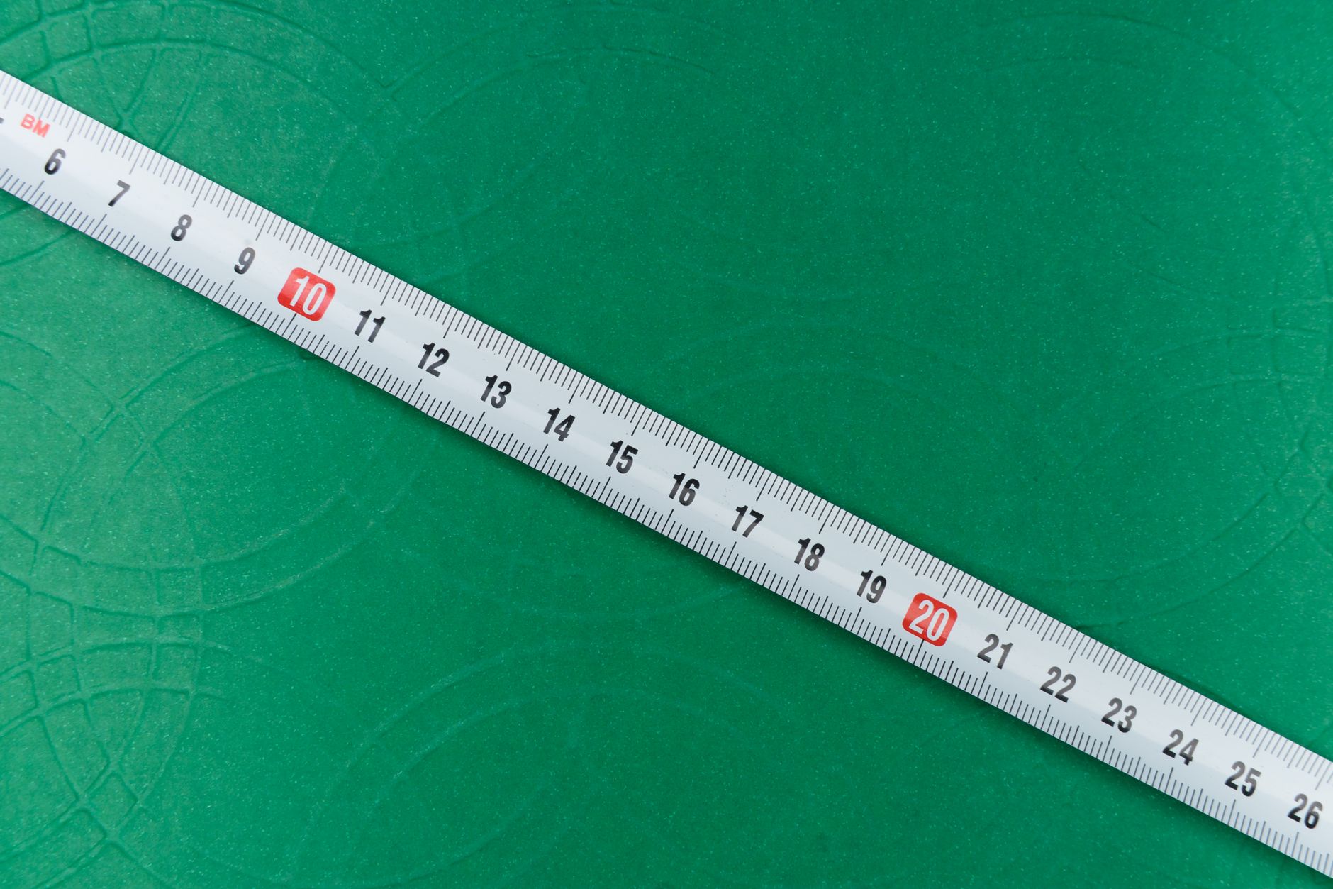 traveler measuring pet carrier length width height on luggage scale