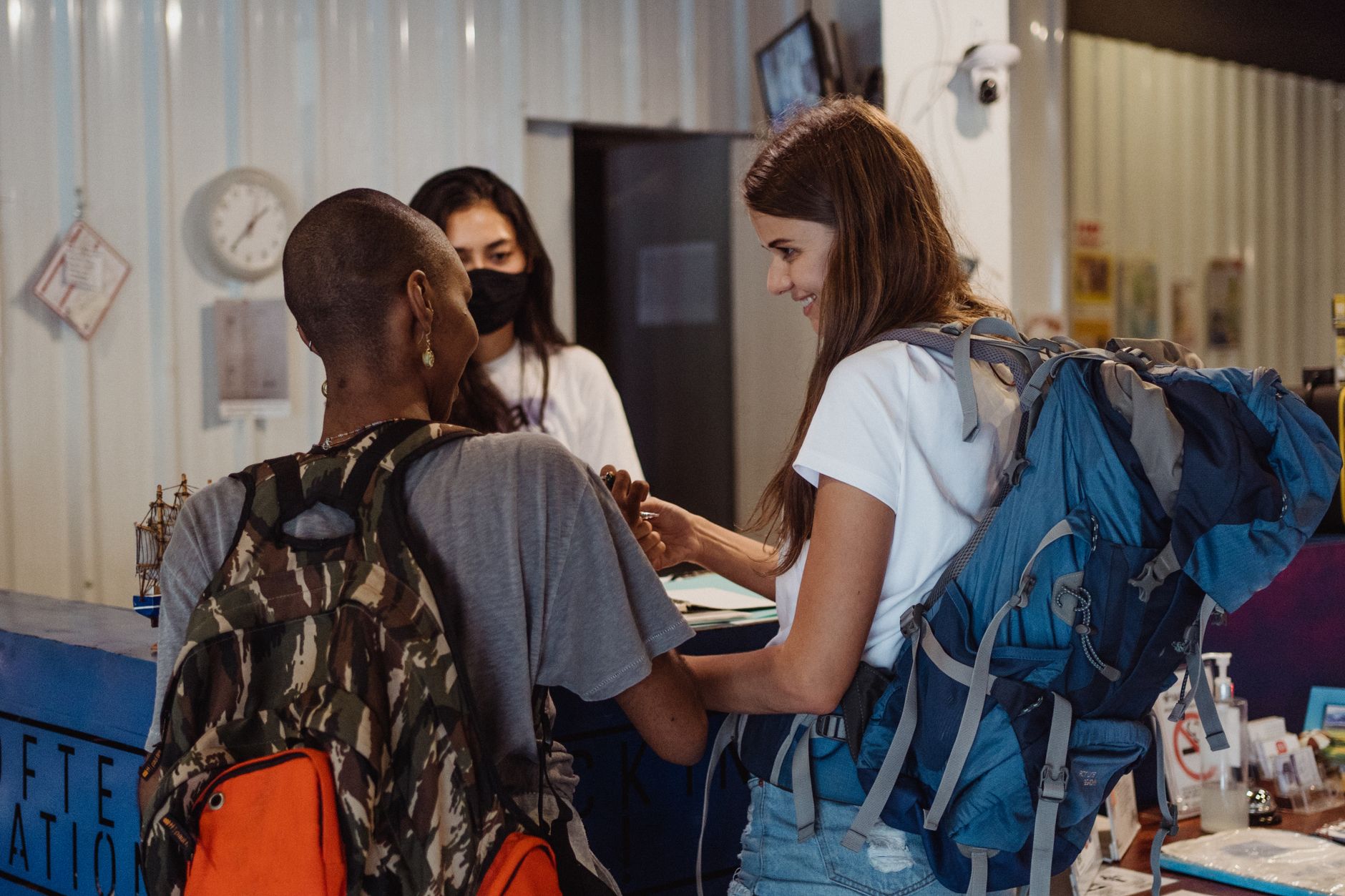 border officer checking a dog microchip at an airport arrivals desk