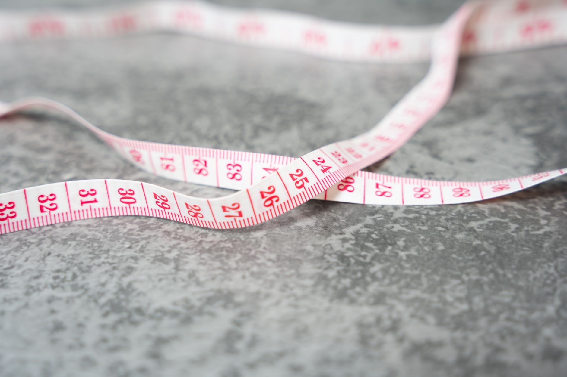 tape measure on soft sided pet carrier at home before trip