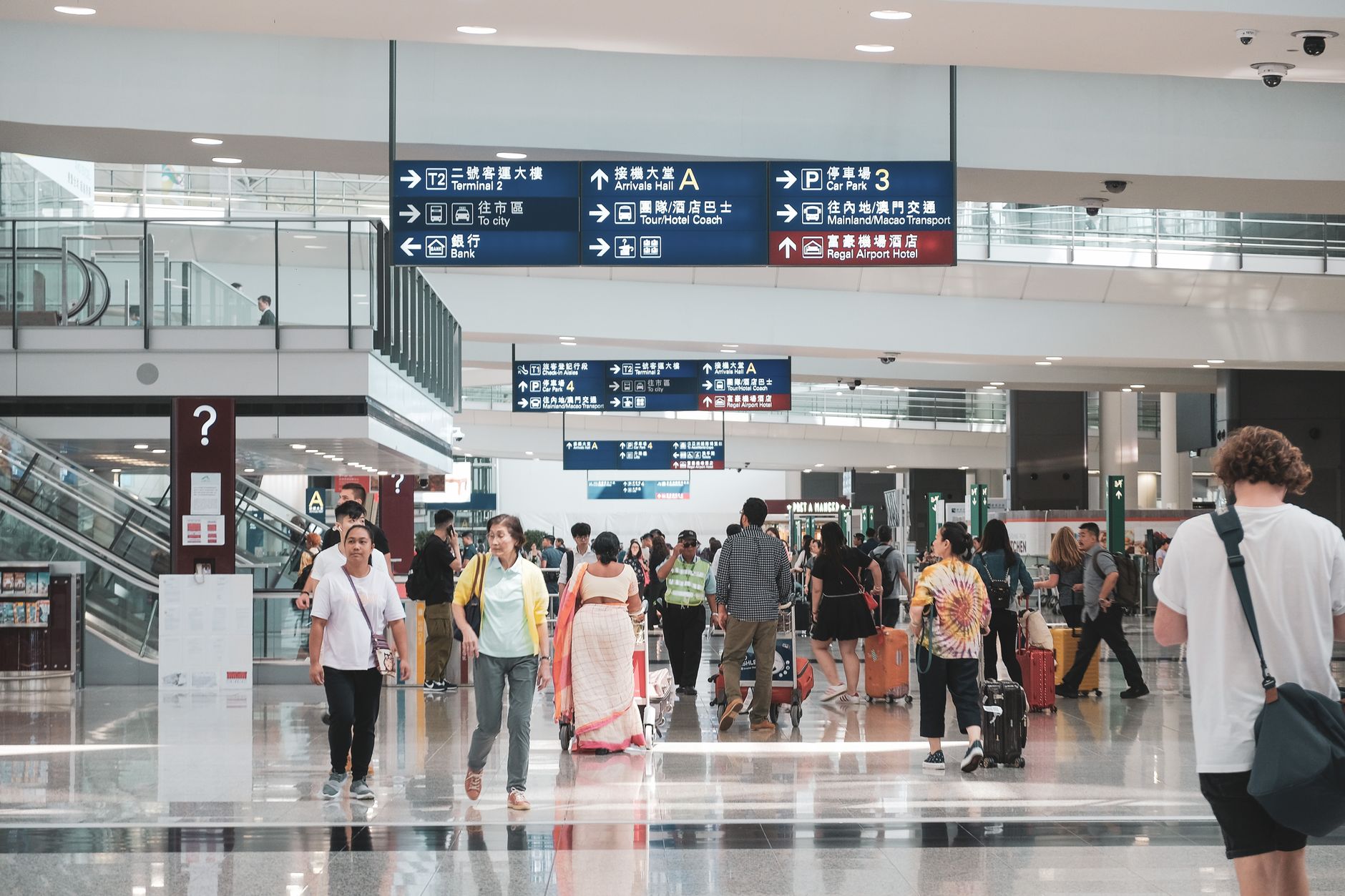 Narita airport arrival hall travelers luggage Japan