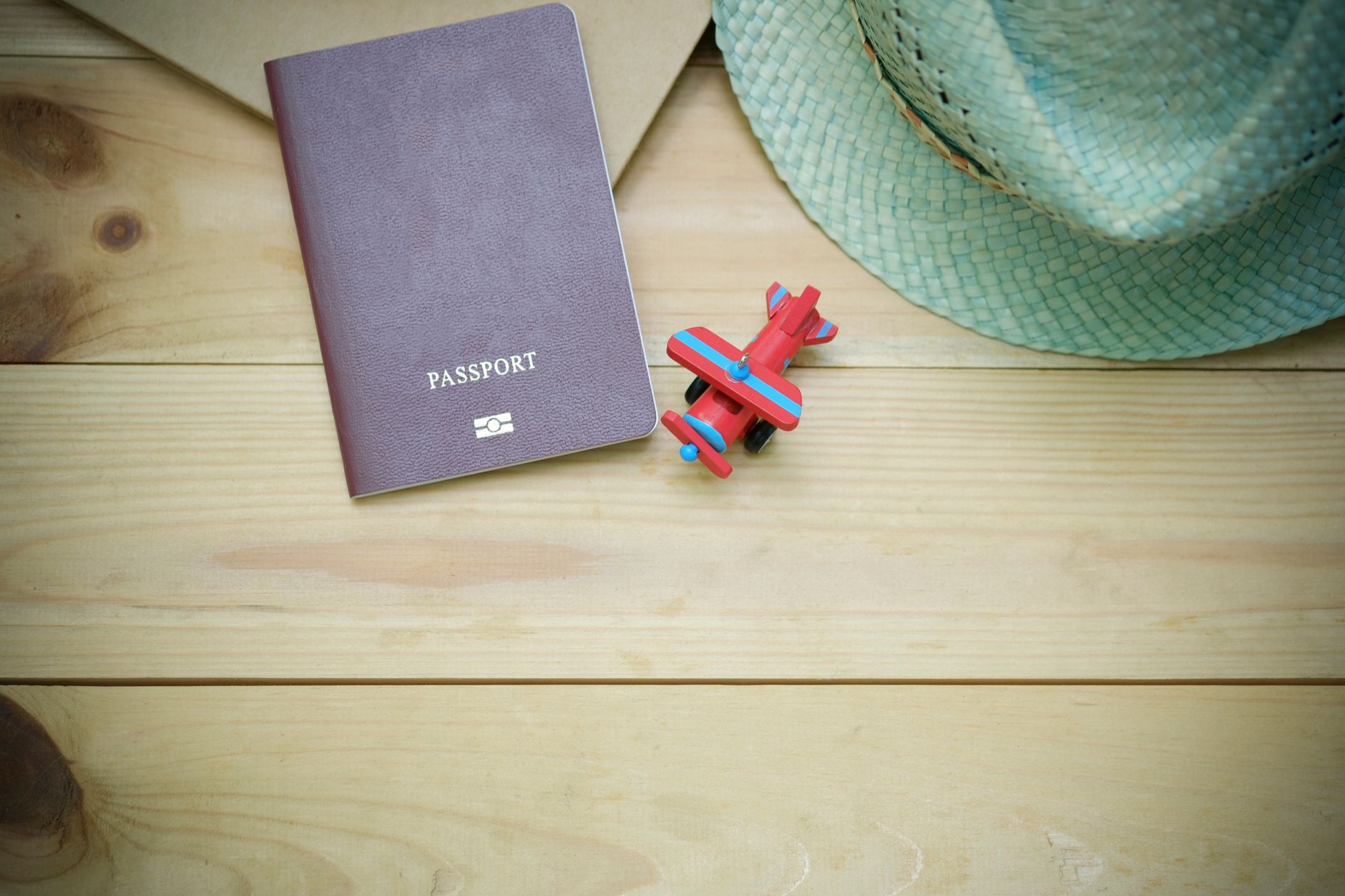 official pet travel booklet beside passport on packing desk