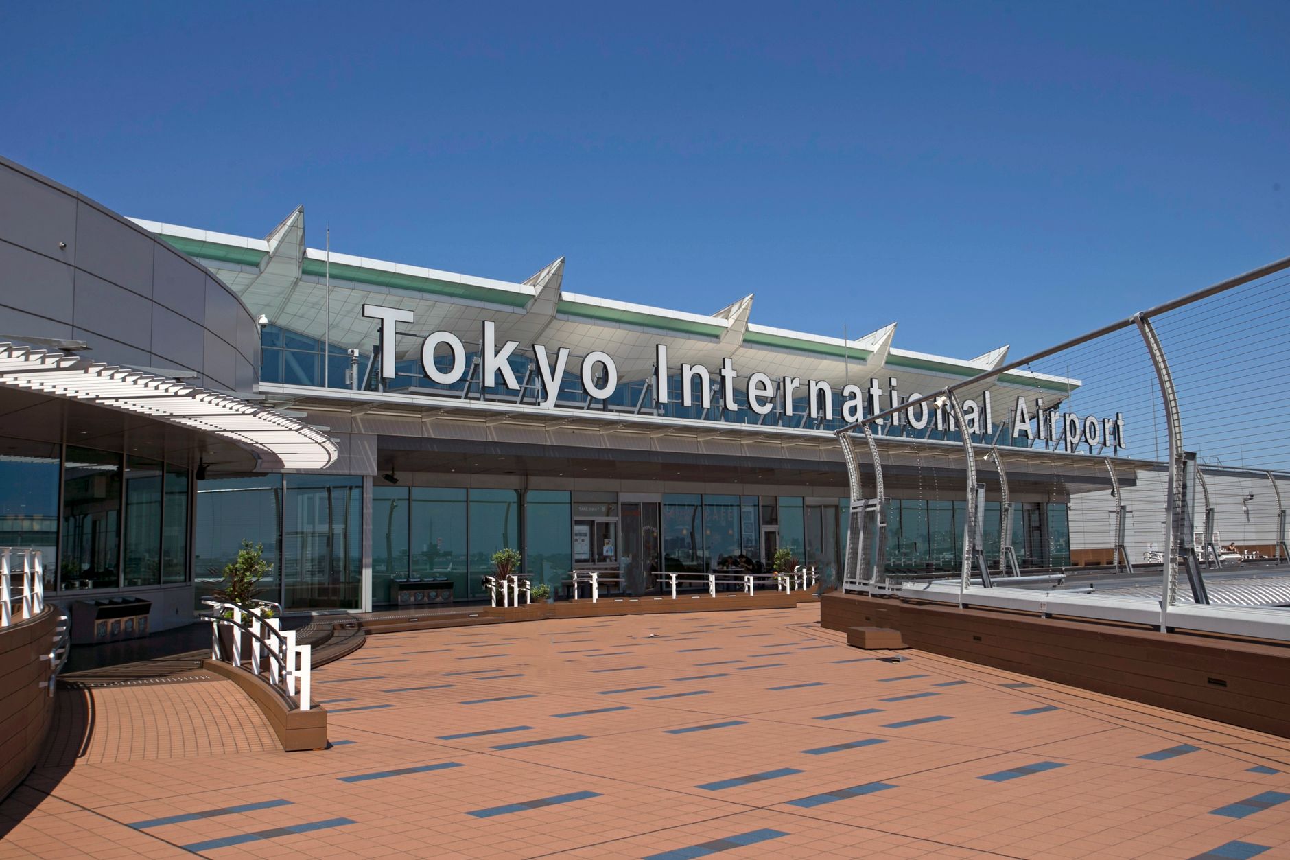 Narita airport arrival hall travelers luggage Japan