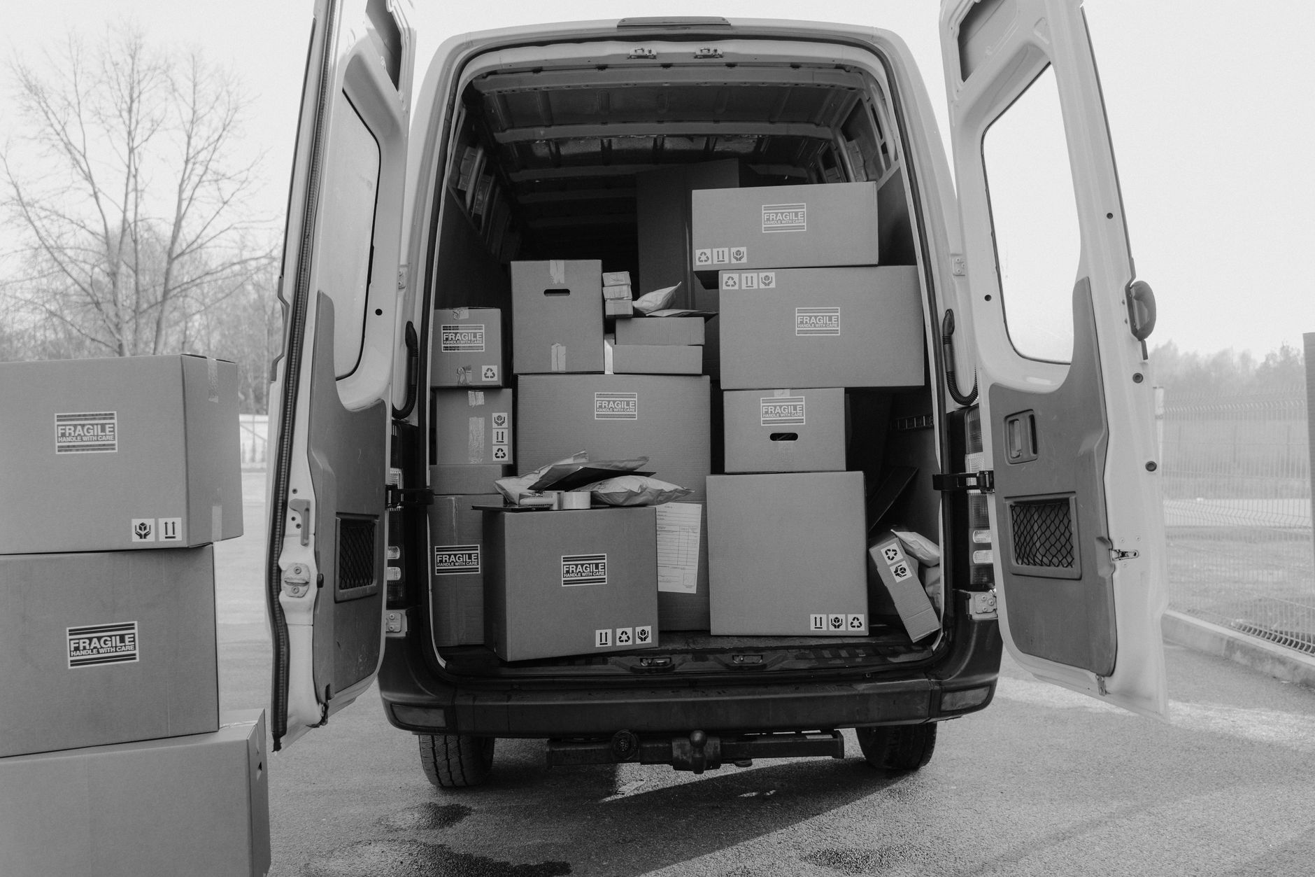 moving van loaded cross country with dog crate roadside stop