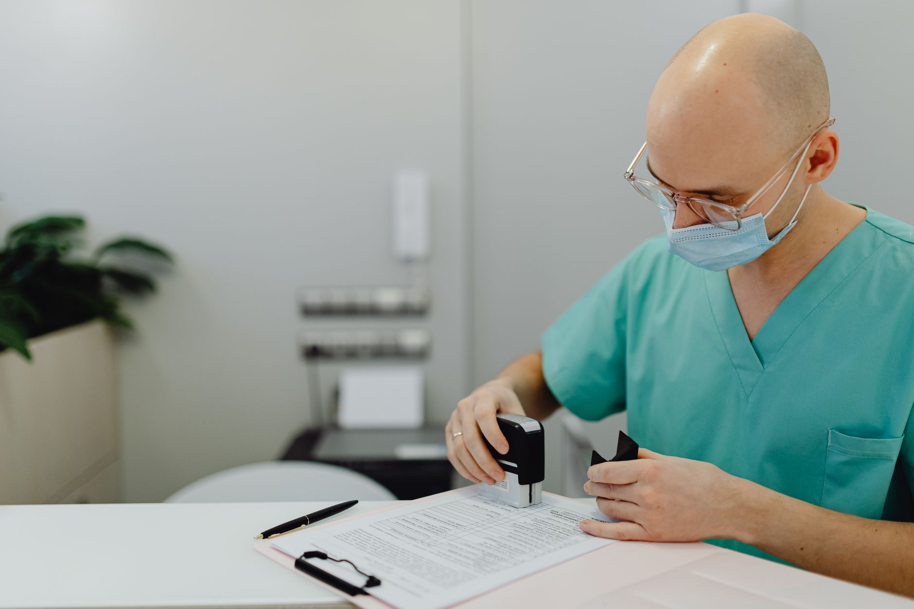 authorised veterinarian stamping EU pet passport booklet at clinic desk
